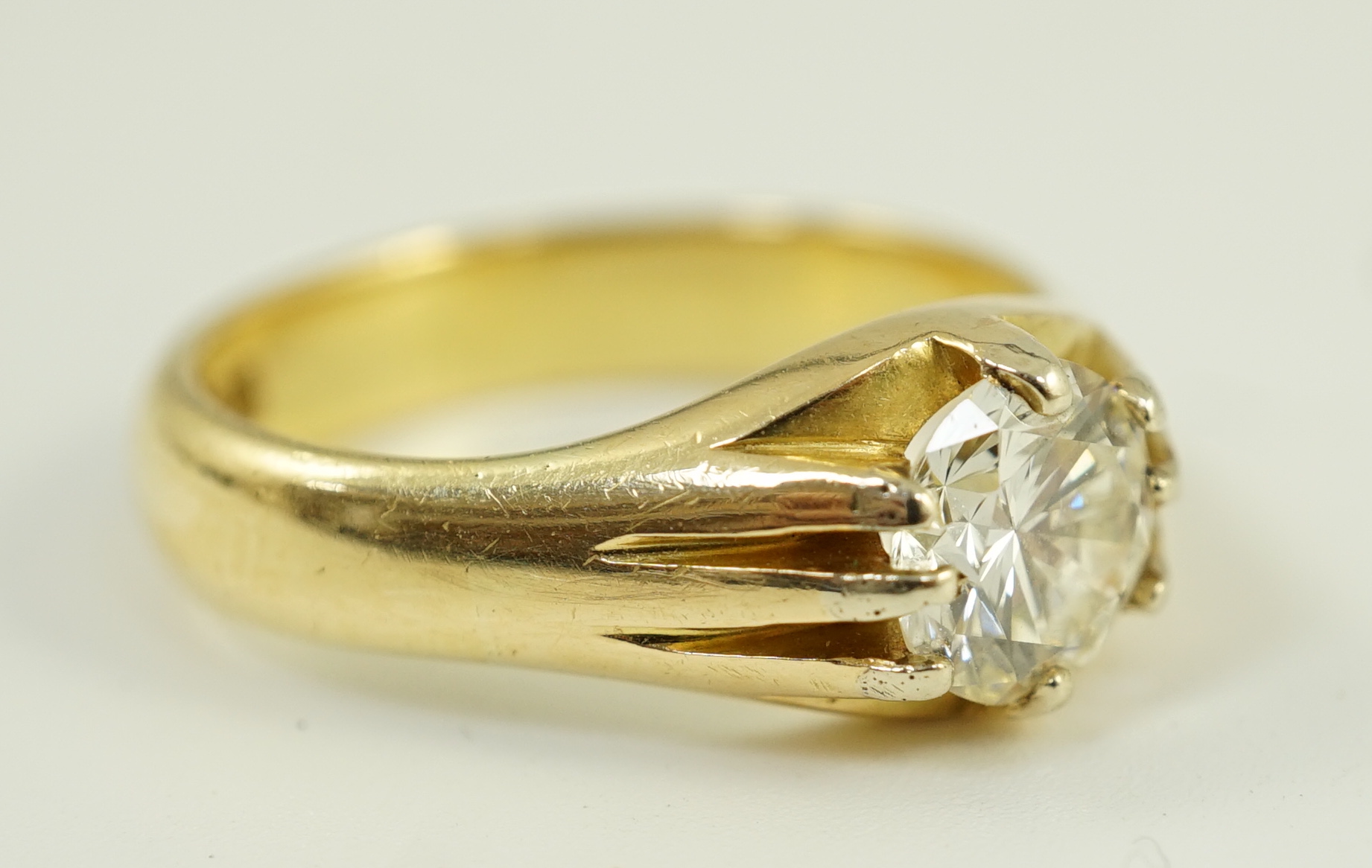 A modern 18ct gold and claw set solitaire diamond ring